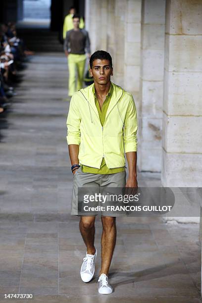 Models display creations by French designer Veronique Nichanian for the label Hermes during the men's spring-summer 2013 fashion collection show on...