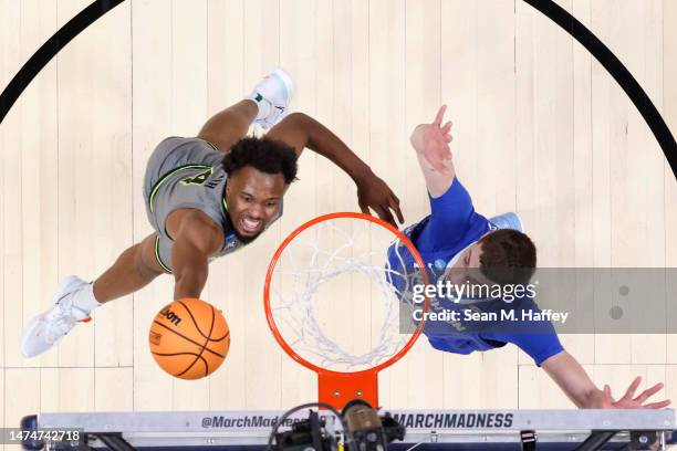 Cryer of the Baylor Bears drives to the basket against Ryan Kalkbrenner of the Creighton Bluejays during the second half in the second round of the...