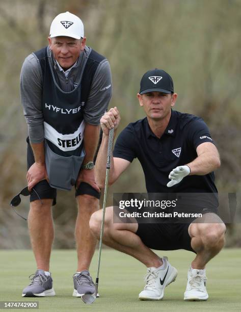 Brendan Steele of Hyflyers GC looks over the 16th green with his caddie during Day Three of the LIV Golf Invitational - Tucson at The Gallery Golf...