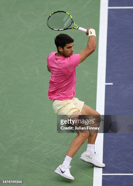 Carlos Alcaraz of Spain in action against Daniil Medvedev in the final during the BNP Paribas Open on March 19, 2023 in Indian Wells, California.