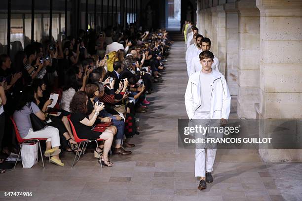 Models display creations by French designer Veronique Nichanian for the label Hermes during the men's spring-summer 2013 fashion collection show on...