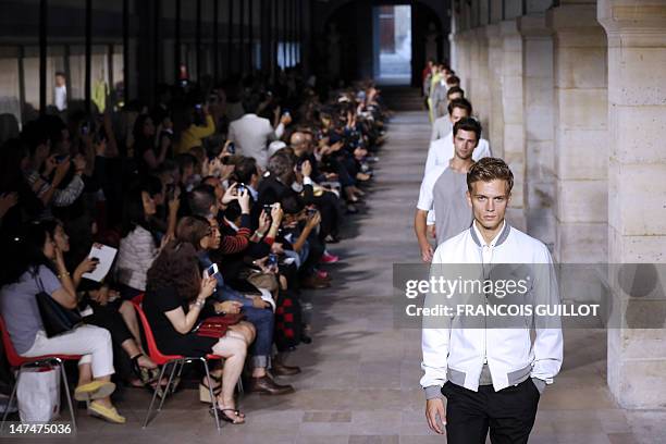 Models display creations by French designer Veronique Nichanian for the label Hermes during the men's spring-summer 2013 fashion collection show on...