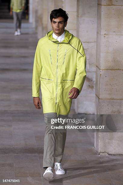 Model displays creations by French designer Veronique Nichanian for the label Hermes during the men's spring-summer 2013 fashion collection show on...