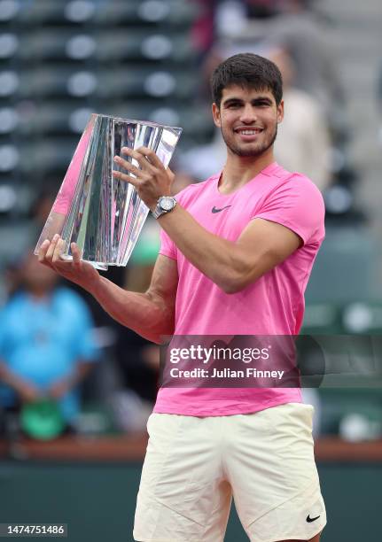 Carlos Alcaraz of Spain with the winners trophy after defeating Daniil Medvedev in the final during the BNP Paribas Open on March 19, 2023 in Indian...