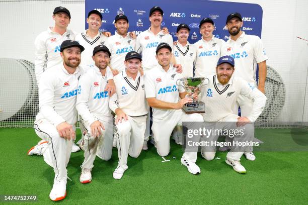 Tim Southee of New Zealand and teammates pose with the series trophy during day four of the Second Test Match between New Zealand and Sri Lanka at...