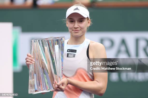Elena Rybakina of Kazakhstan poses with the winner's trophy after defeating Aryna Sabalenka of Belarus during the Women's Final of the BNP Paribas...