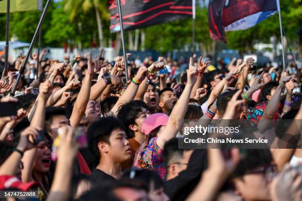 Audience enjoy a performance during Haikou Midi Festival, one of China's earliest and best-established rock festival brands, on March 19, 2023 in...