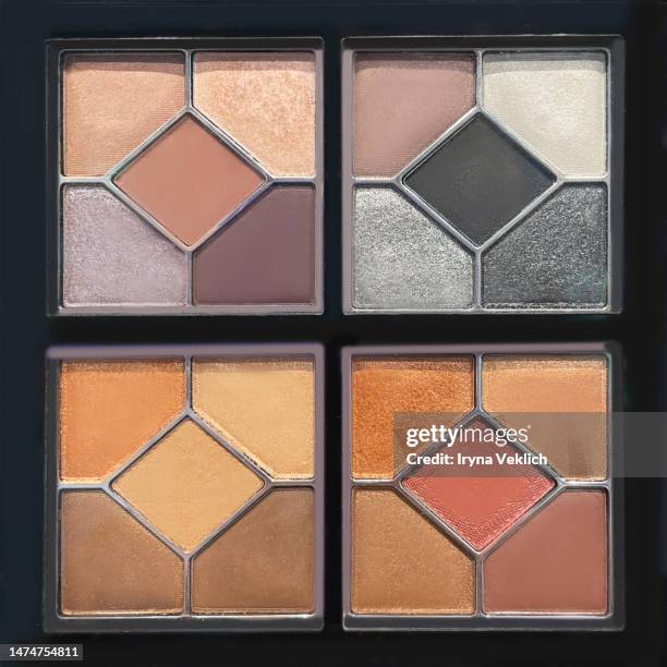 make-up cosmetic product for a woman - eyeshadow beige, brown, orange and grey silver colors. - paleta de maquillaje fotografías e imágenes de stock