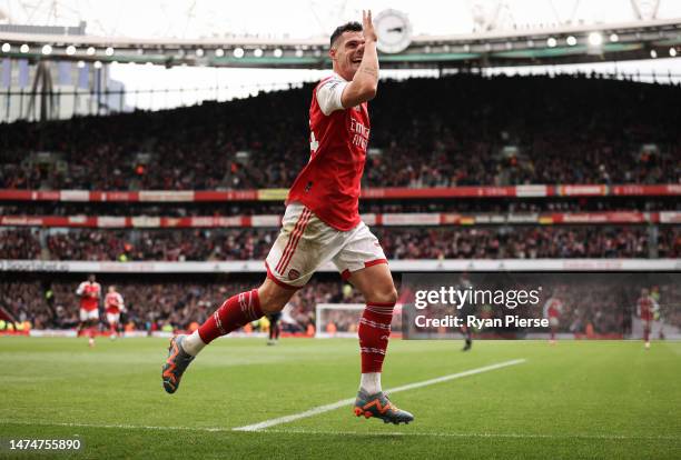 Granit Xhaka of Arsenal celebrates after scoring his teams third goal during the Premier League match between Arsenal FC and Crystal Palace at...