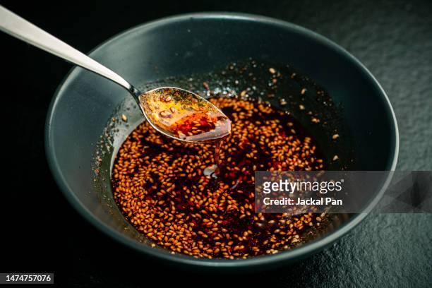 spicy pepper in oil - sesame oil stock pictures, royalty-free photos & images