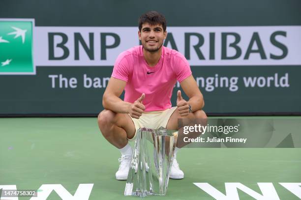 Carlos Alcaraz of Spain with the winners trophy after defeating Daniil Medvedev in the final during the BNP Paribas Open on March 19, 2023 in Indian...