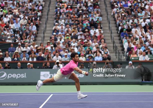 Carlos Alcaraz of Spain in action against Daniil Medvedev in the final during the BNP Paribas Open on March 19, 2023 in Indian Wells, California.