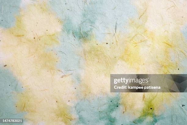 handmade recycled mulberry paper watercolor paint background. - handmade paper stock pictures, royalty-free photos & images