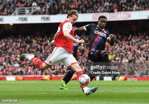 Rob Holding of Arsenal is closed down by Marc Guehi of Palace during the Premier League match between Arsenal FC and Crystal Palace at Emirates...