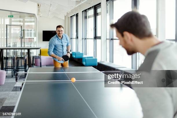 colleagues playing ping pong table tennis - table tennis stock pictures, royalty-free photos & images