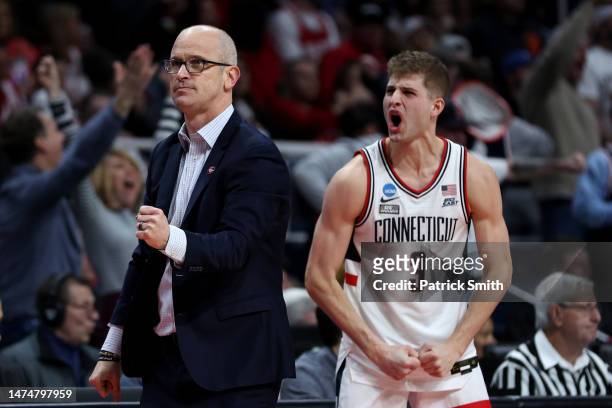 Head coach Dan Hurley and Joey Calcaterra of the Connecticut Huskies celebrate in the second half against the St. Mary's Gaels during the second...