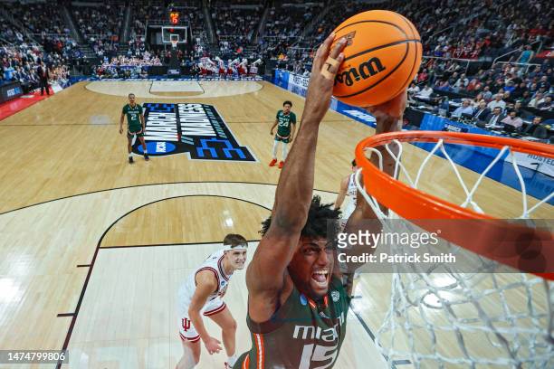 Norchad Omier of the Miami Hurricanes dunks in the second half against the Indiana Hoosiers during the second round of the NCAA Men's Basketball...