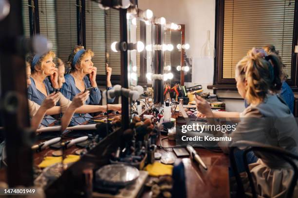 two actresses are in the dressing room of the theater and are preparing to go on stage - backstage mirror stock pictures, royalty-free photos & images