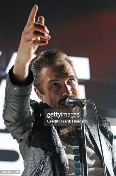 Singer Adam Grahn of the band Royal Republic performs live in support of Blink 182 during a concert at the Max-Schmeling-Halle on June 30, 2012 in...