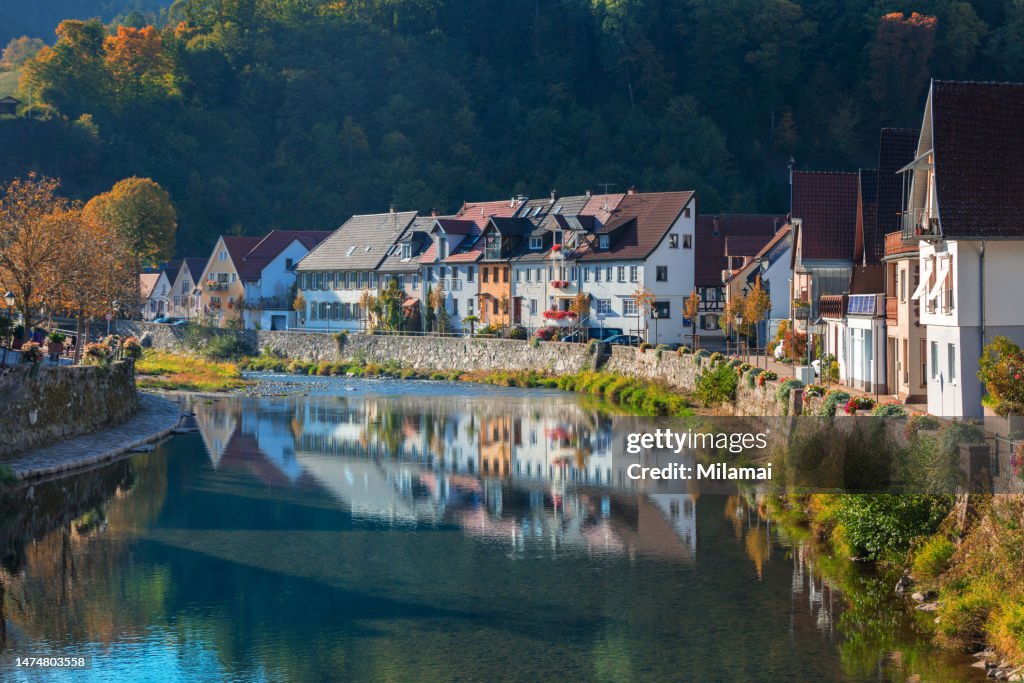 River Kinzig in Wolfach and waterfront houses in Kinzigtal Valley, daytime, Black Forest, fall season