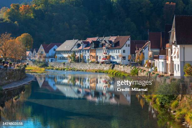 river kinzig in wolfach and waterfront houses in kinzigtal valley, daytime, black forest, fall season - idyllic house stock pictures, royalty-free photos & images