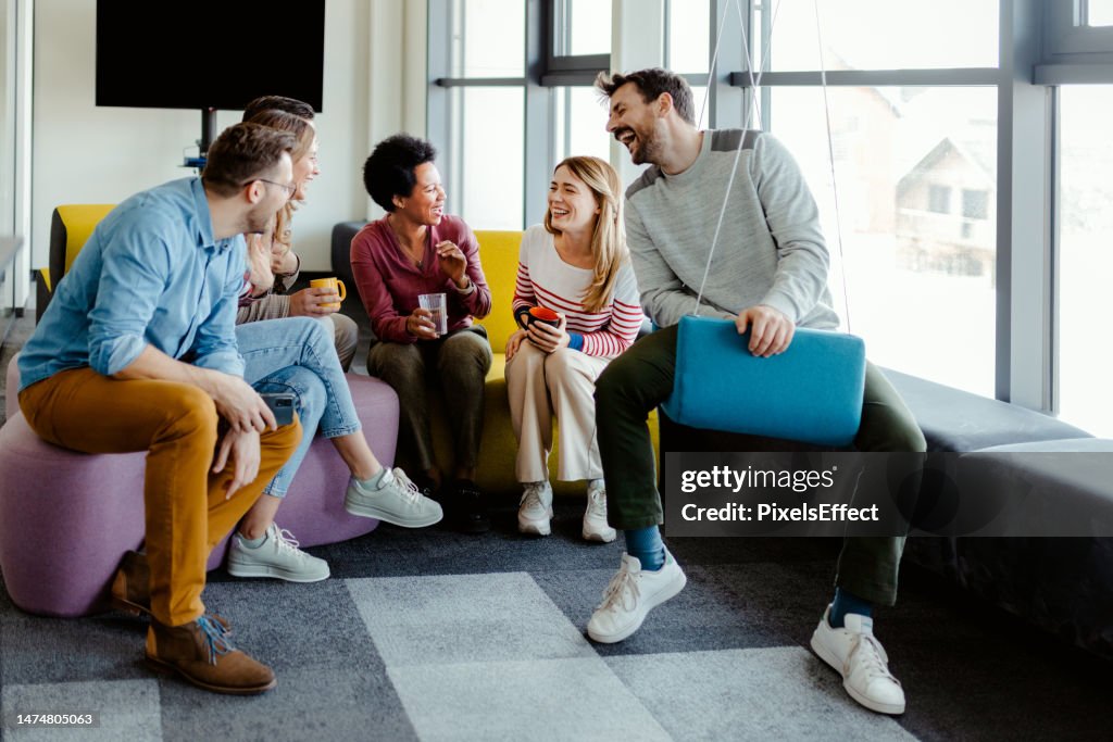 Colleague Taking Break in Modern Office Break Out Area