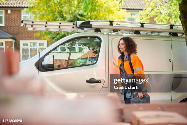 female contractor arrives at job - plumber van stock pictures, royalty-free photos & images