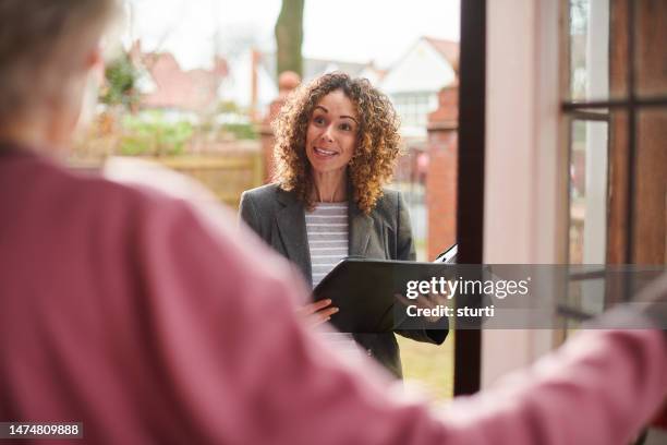 care visit to elderly tenant - front door stock pictures, royalty-free photos & images