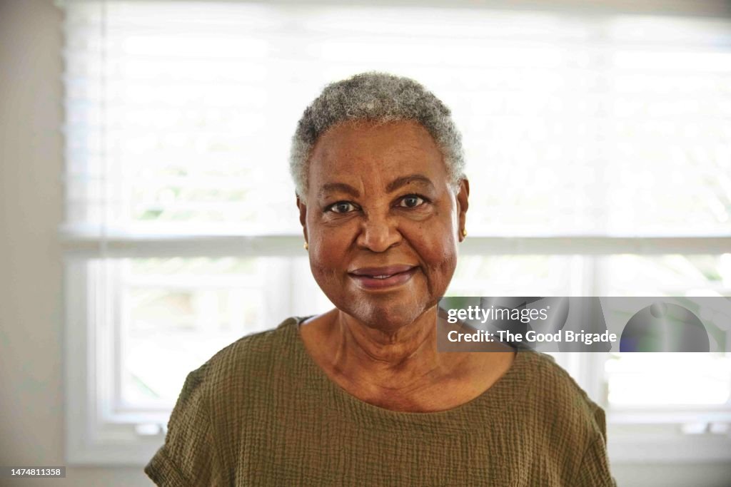 Portrait of cheerful senior woman with short gray hair