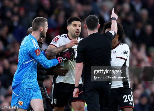 Aleksandar Mitrovic of Fulham receives a red card from Referee Chris Kavanagh during the Emirates FA Cup Quarter Final match between Manchester...