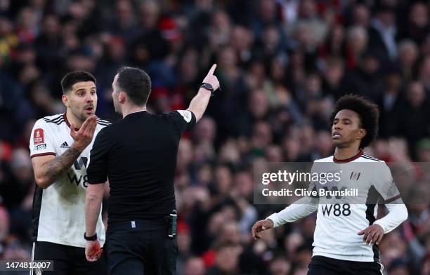 Aleksandar Mitrovic of Fulham receives a red card from Referee Chris Kavanagh watched by Willian of Fulham who also received a red card for hand ball...