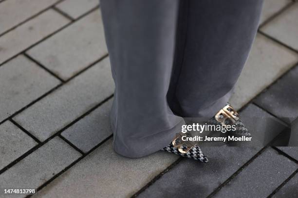Maria Barteczko seen wearing NA-KD grey wide leg jogging pants, Balenciaga pointy houndstooth kitten heels, on March 18, 2023 in Dusseldorf, Germany.