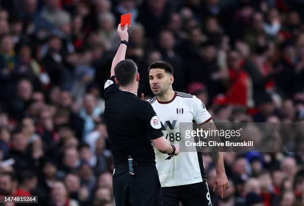 Aleksandar Mitrovic of Fulham receives a red card from Referee Chris Kavanagh during the Emirates FA Cup Quarter Final match between Manchester...