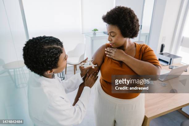 measuring human arm body fat - doctor's office scale stock pictures, royalty-free photos & images