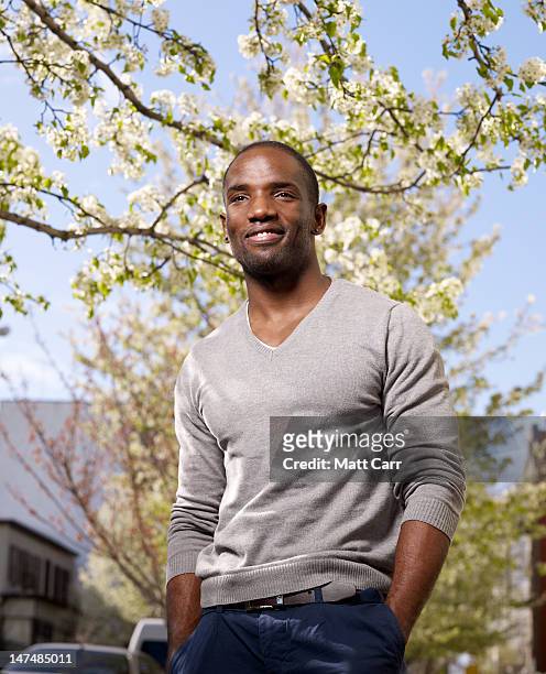 young man in urban environment - v neck stock pictures, royalty-free photos & images