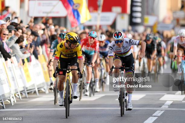 Primoz Roglic of Slovenia and Team Jumbo-Visma crosses the finish line as stage winner ahead of Remco Evenepoel of Belgium and Team Soudal Quick-Step...