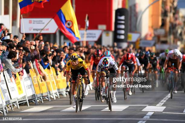 Primoz Roglic of Slovenia and Team Jumbo-Visma and Remco Evenepoel of Belgium and Team Soudal Quick-Step sprint at finish line during the 102nd Volta...