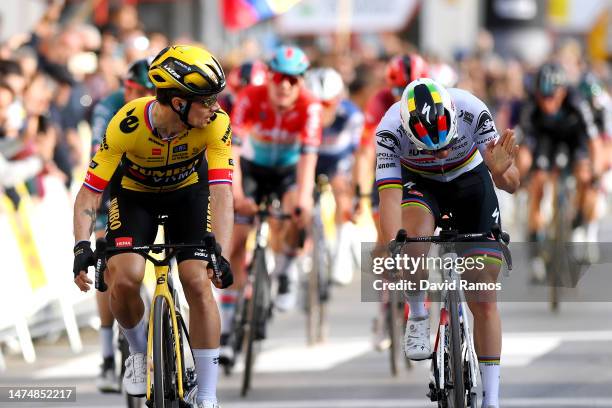 Primoz Roglic of Slovenia and Team Jumbo-Visma crosses the finish line as stage winner ahead of Remco Evenepoel of Belgium and Team Soudal Quick-Step...