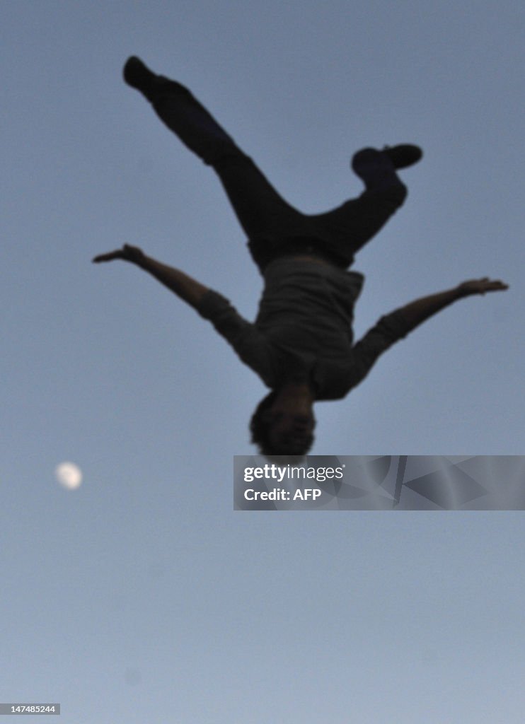 An acrobat performs onJune 30, 2012 in t