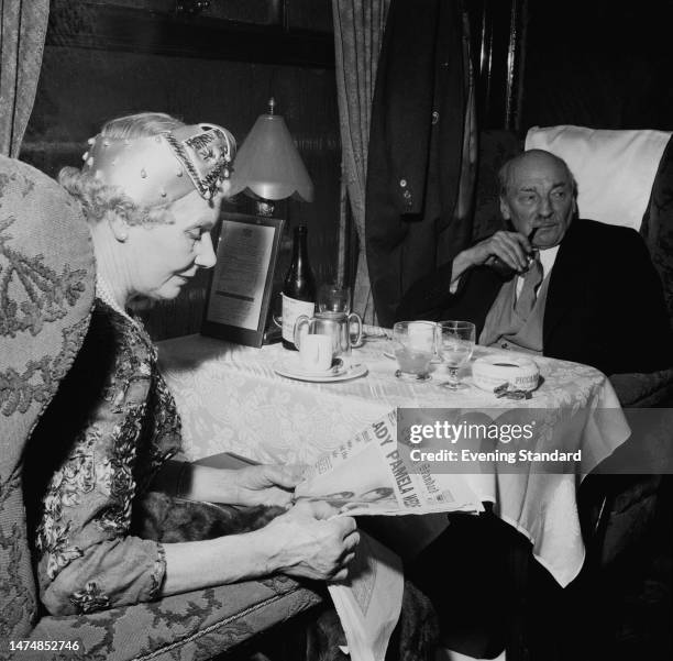 Violet Attlee and husband Clement Attlee on a train from Waterloo to Romsey, Hampshire, to attend the wedding of David Hicks and Lady Pamela...