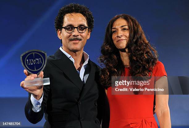 Beppe Fiorello receives the Lancia Award from Antonella Bruno, Market Director Italy of Lancia Brand at Fiat Group during the 2012 Nastri d'Argento...