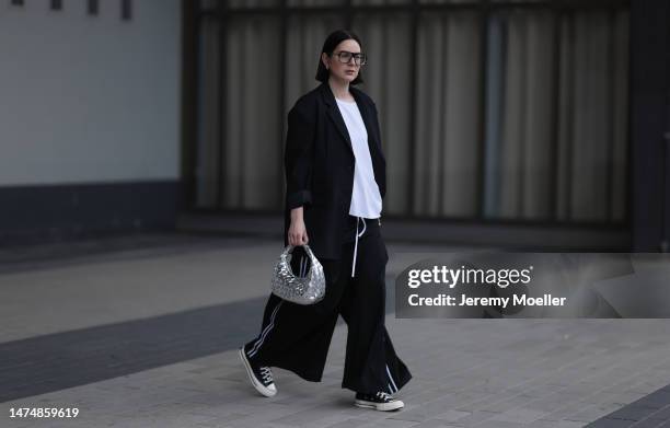 Maria Barteczko seen wearing Victoria Beckham black oversized Aviator glasses, WENDYKEI black oversized blazer, WENDYKEI white asymmetric shirt,...