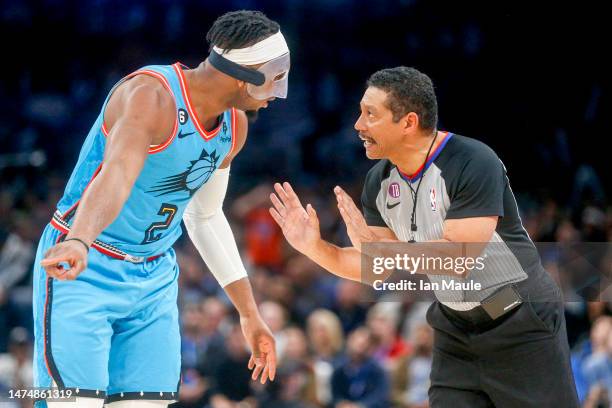 Josh Okogie of the Phoenix Suns talks to referee Bill Kennedy during the fourth quarter of Okogie's against the Oklahoma City Thunder at Paycom...