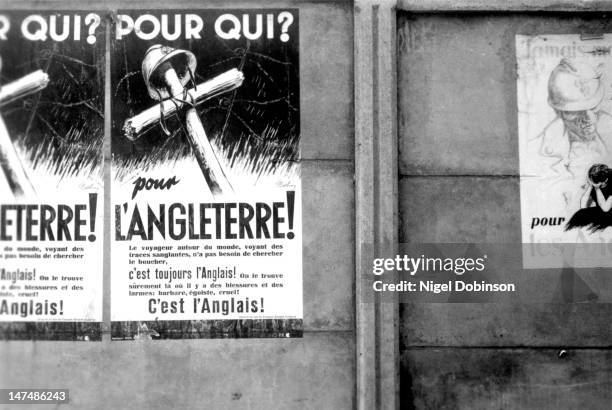 View of Nazi propoganda posters on a wall, France, 1939-45. The texts accused the English of being cruel and barbaric butchers.