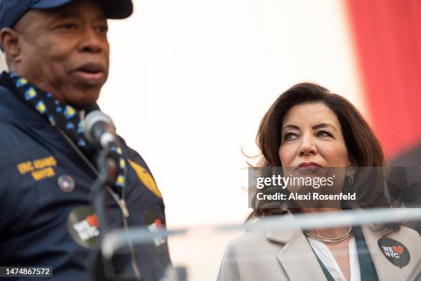 Governor Kathy Hochul looks at New York City Mayor Eric Adams speak at the campaign launch event for 'We Love NYC' in Times Square on March 20, 2023...