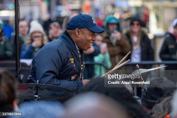 New York City Mayor Eric Adams plays the drums at the campaign launch event for 'We Love NYC' in Times Square on March 20, 2023 in New York City. The...