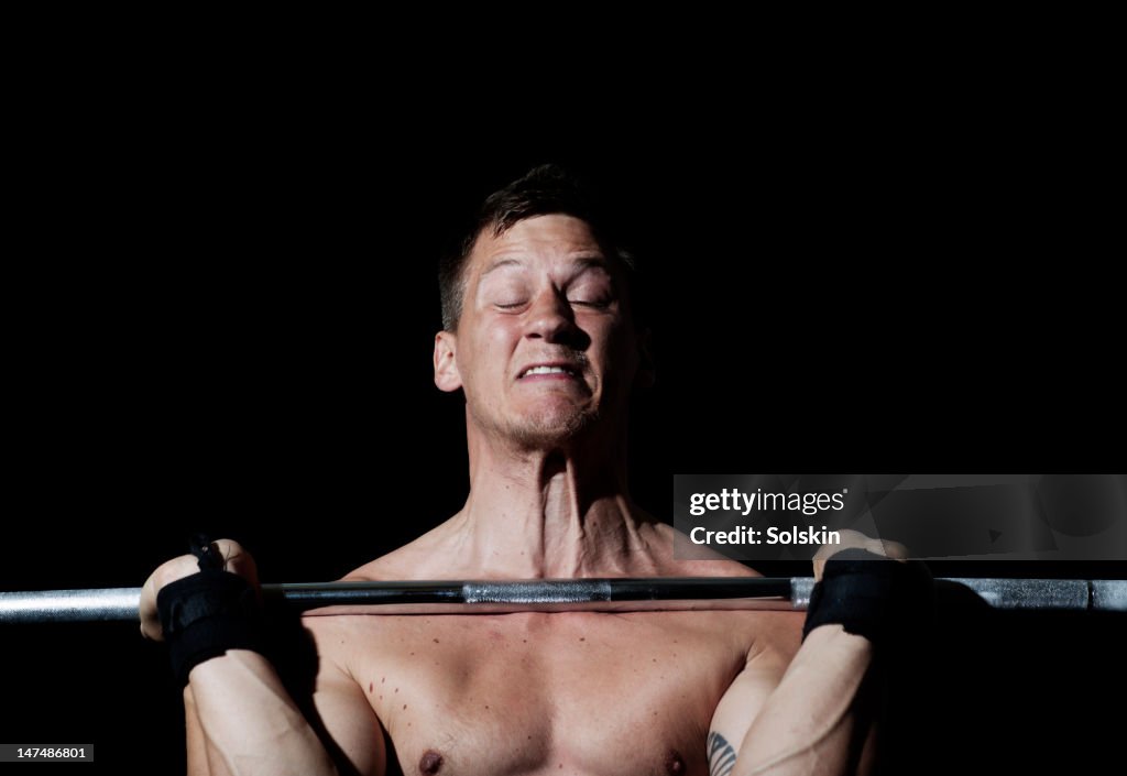 Man weightlifting in gym gym