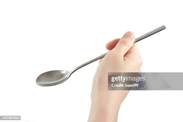 geste: holding spoon - spoon in hand stock-fotos und bilder