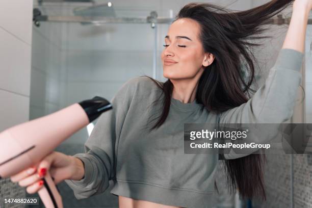 having a good time - hand holding hair dryer stock pictures, royalty-free photos & images