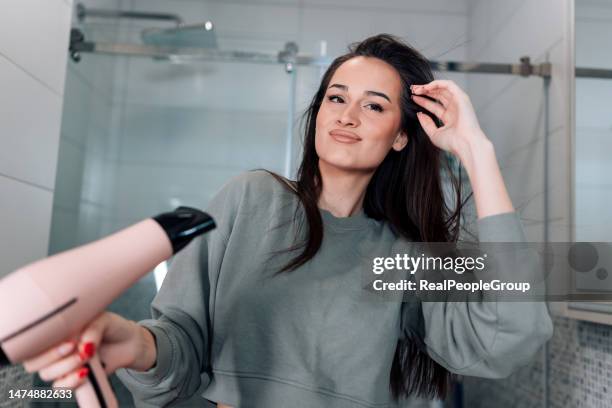 i like what i see - hand holding hair dryer stock pictures, royalty-free photos & images